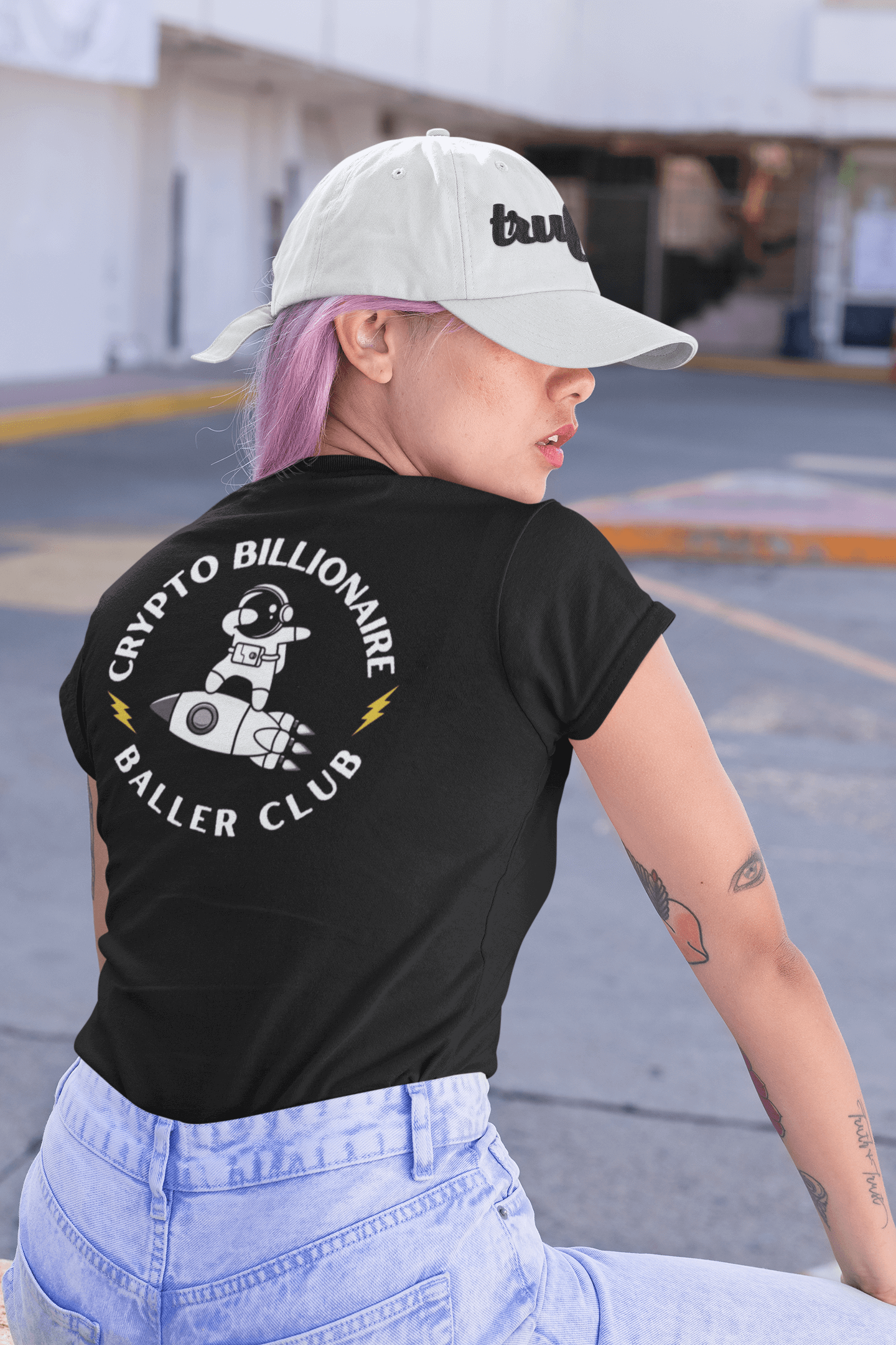 Woman wearing "Crypto Billionaire Baller Club" NFT T-Shirt in black