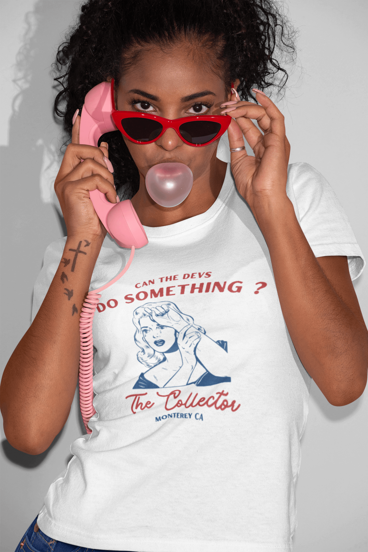 Woman blowing bubble wearing "Can the devs do something?" NFT T-shirt