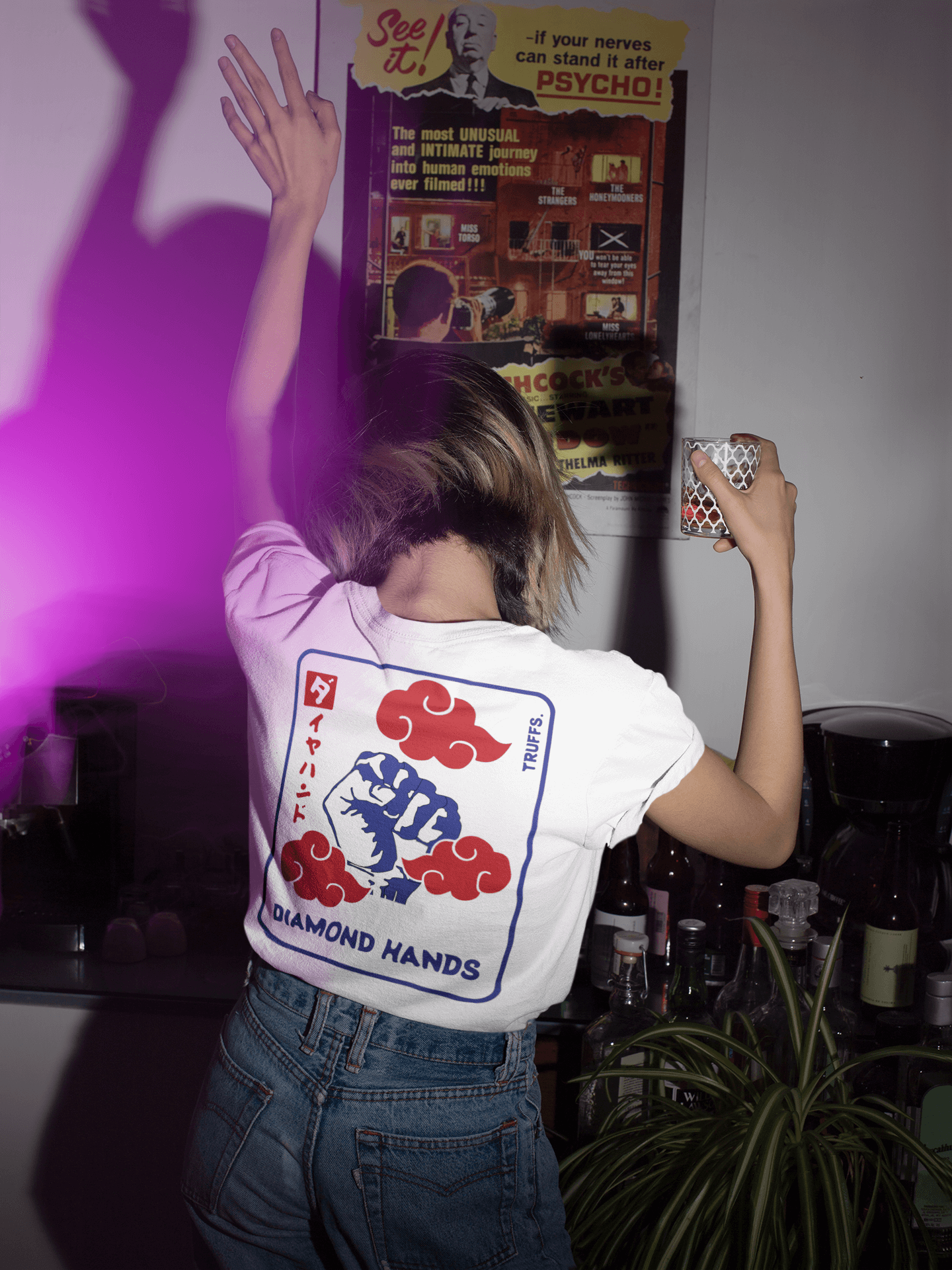 Woman in house party wearing "Diamond hands" NFT T-Shirt