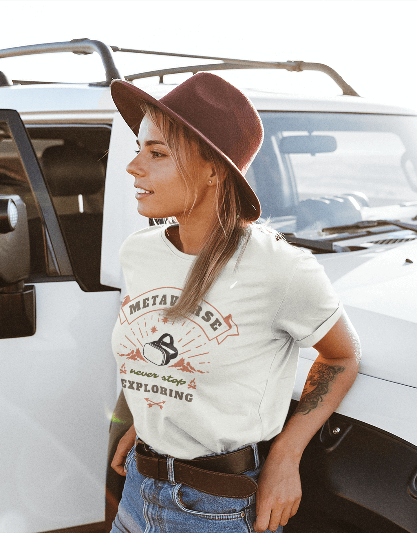 Woman leaning on jeep wearing Metaverse NFT T-Shirt